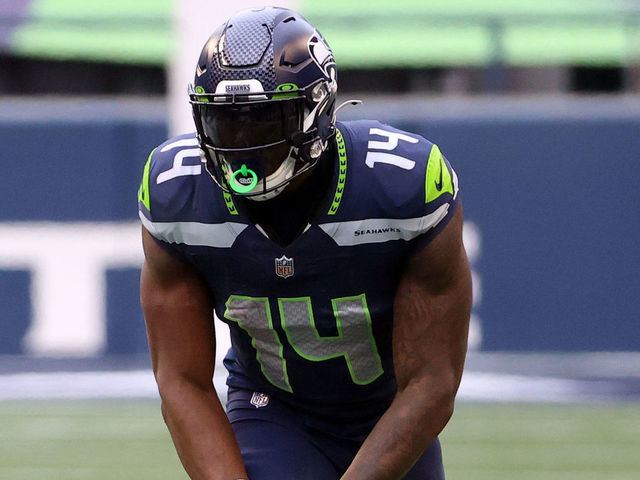 SEATTLE, WASHINGTON - JANUARY 09: DK Metcalf #14 of the Seattle Seahawks and Jalen Ramsey #20 of the Los Angeles Rams line up for play in the second quarter during the NFC Wild Card Playoff game at Lumen Field on January 09, 2021 in Seattle, Washington.