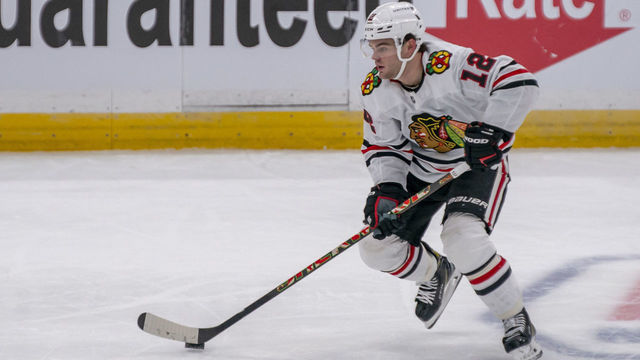 TAMPA, FL - JANUARY 13: Chicago Blackhawks left wing Alex DeBrincat (12) during the NHL Hockey match between the Lightning and Blackhawks on January 13, 2021 at Amalie Arena in Tampa, FL.
