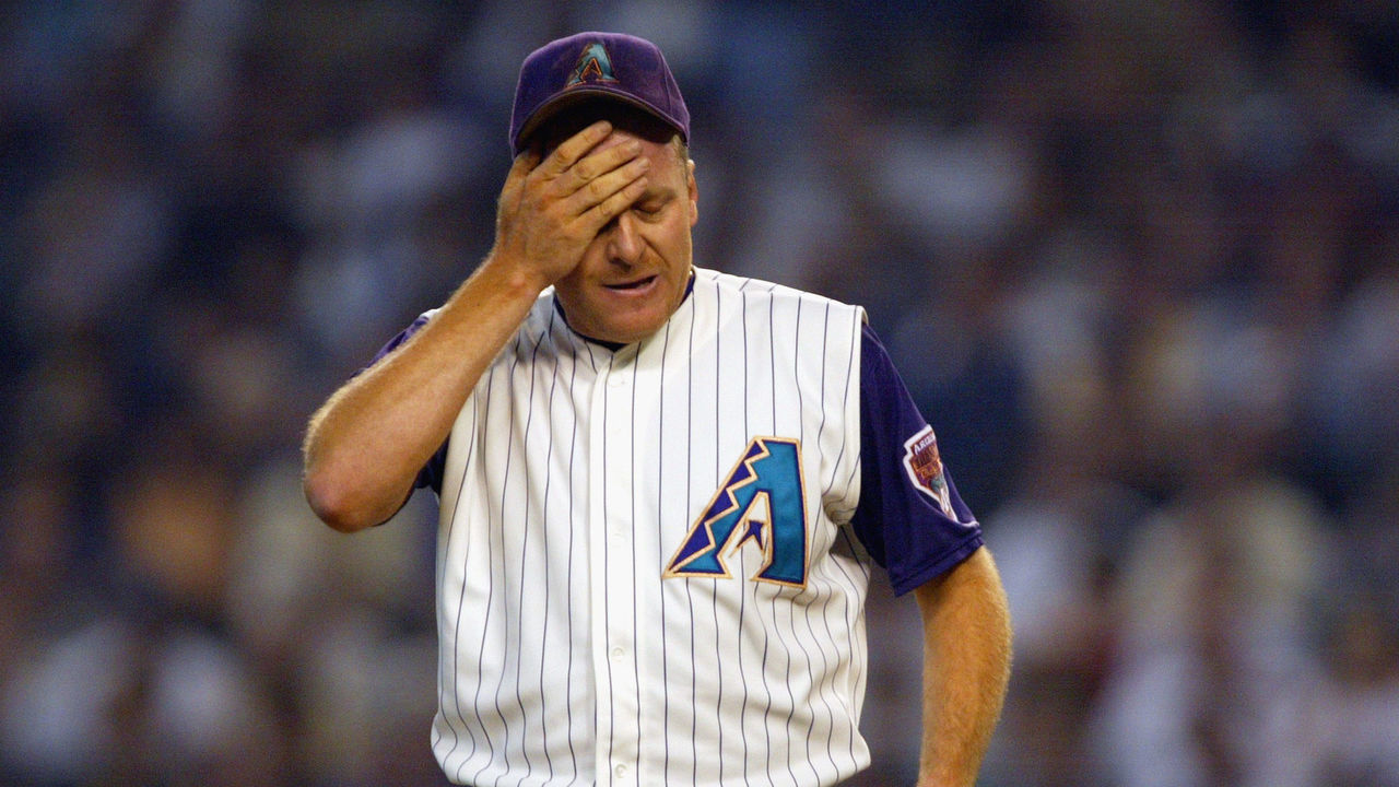PHOENIX - October 3: Right-hander Curt Schilling #38 of the Arizona Diamondbacks wipes his head in frustration after giving up a solo home run to J.D. Drew #7 of the St. Louis Cardinals during the third inning of Game 2 of the National League Division Series on October 3, 2002 at Bank One Ball Park, in Phoenix, Arizona. The Cardinals won 2-1.