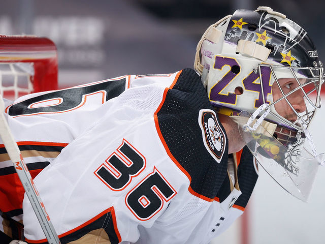 GLENDALE, ARIZONA - JANUARY 26: Goaltender John Gibson #36 of the Anaheim Ducks looks down ice during the first period of the NHL game against the Arizona Coyotes at Gila River Arena on January 26, 2021 in Glendale, Arizona. Gibson is wearing a #24 and #8 on his mask in honor of the late NBA superstar Kobe Bryant of the Los Angeles Lakers.