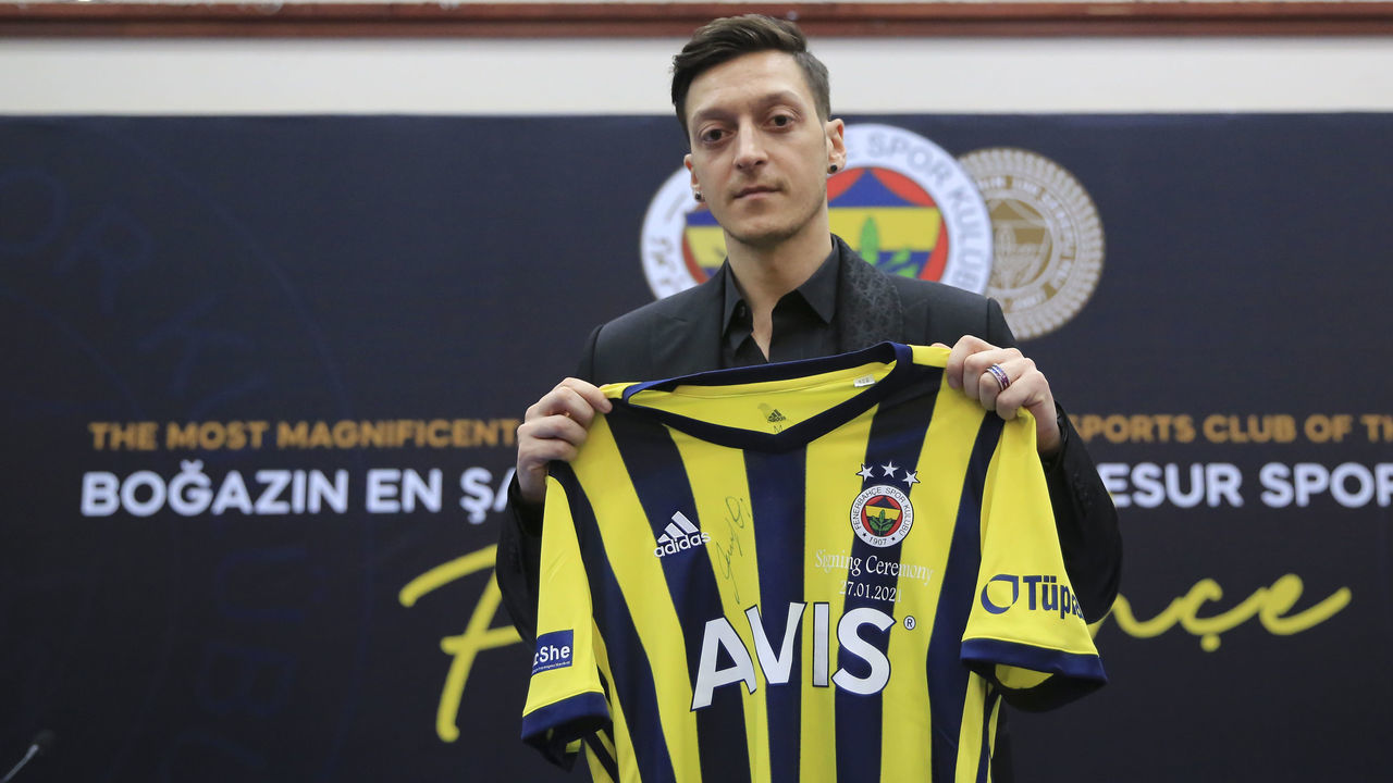 ISTANBUL, TURKEY - JANUARY 27: New transfer of Fenerbahce, Mesut Ozil poses for a photo with his new jersey during signing ceremony after he was transferred from Arsenal at Faruk Ilgaz Facilities in Istanbul, Turkey on January 27, 2021.