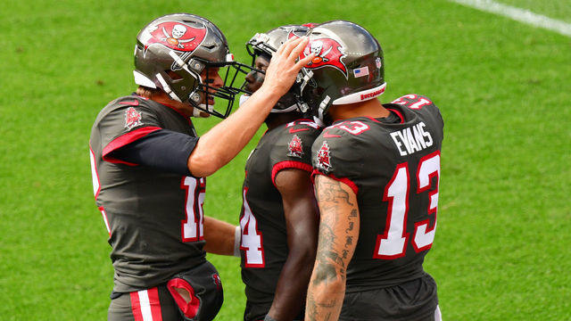 CO - SEPTEMBER 27 : From left, Tampa Bay Buccaneers QB Tom Brady (12), WRChris Godwin (14) and WR Mike Evans celebrate Godwin's first touch down of the game against Denver Broncos at Empower Field at Mile High in Denver, Colorado on Sunday. September 27, 2020.