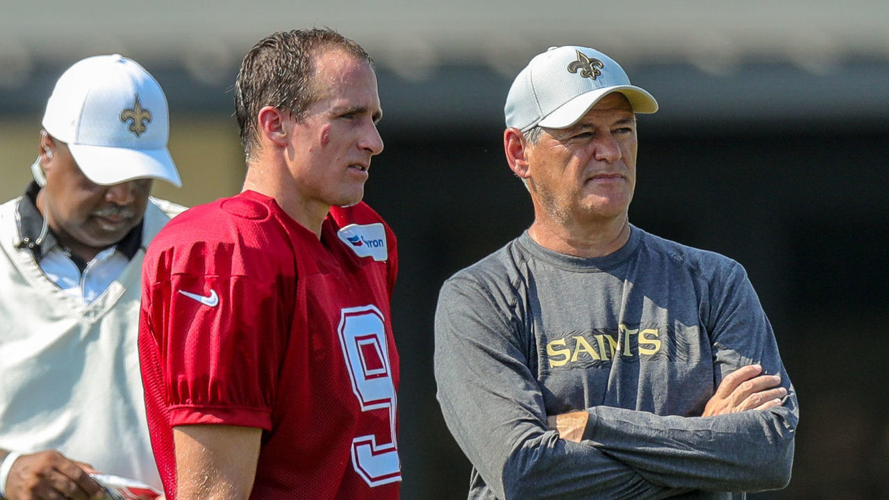 METAIRIE, LA. - JULY 28: New Orleans Saints quarterback Drew Brees (9) talks with General Manager Mickey Loomis during New Orleans Saints training camp practice on July 28, 2018 at the Ochsner Sports Performance Center in New Orleans, LA.