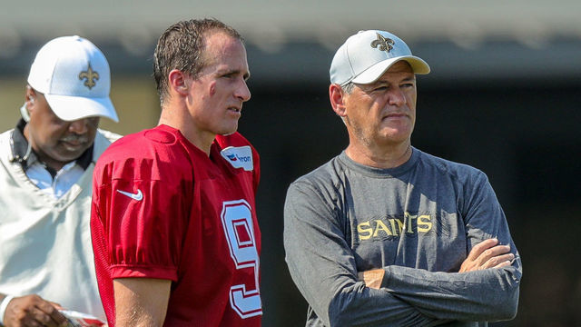 METAIRIE, LA. - JULY 28: New Orleans Saints quarterback Drew Brees (9) talks with General Manager Mickey Loomis during New Orleans Saints training camp practice on July 28, 2018 at the Ochsner Sports Performance Center in New Orleans, LA.
