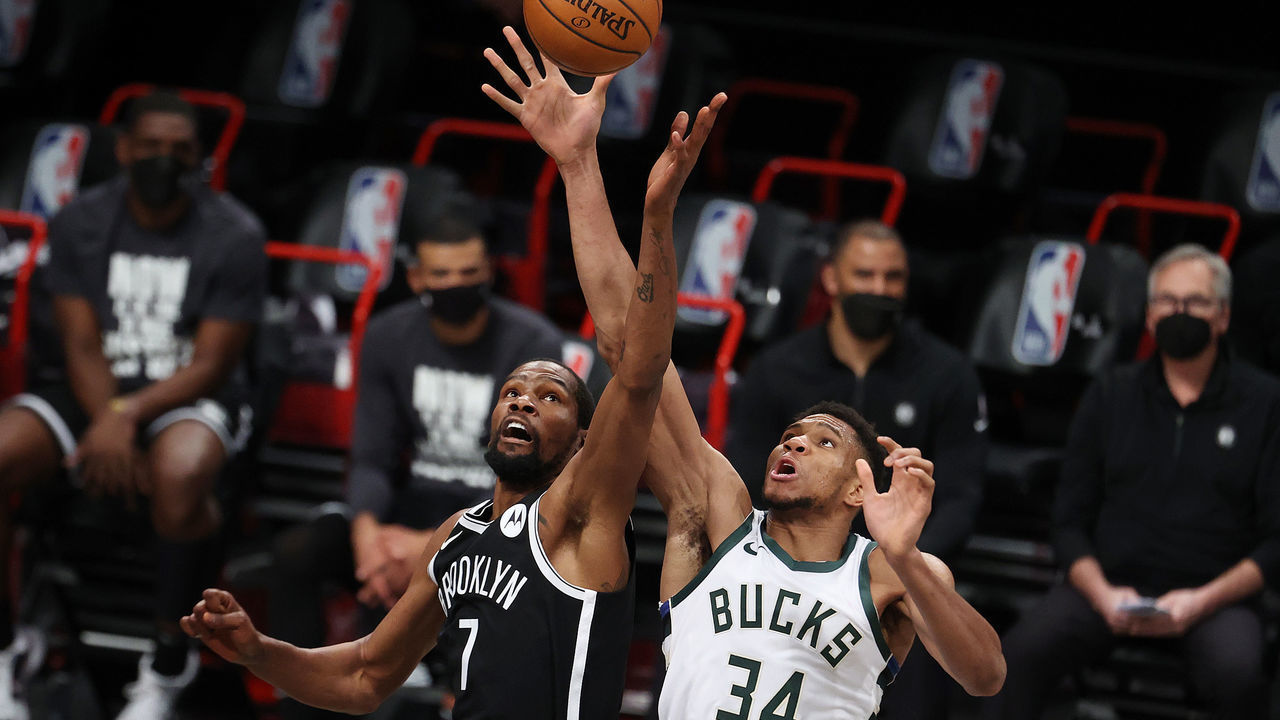 NEW YORK, NEW YORK - JANUARY 18: Kevin Durant #7 of the Brooklyn Nets and Giannis Antetokounmpo #34 of the Milwaukee Bucks jump for the ball during their game at Barclays Center on January 18, 2021 in New York City. NOTE TO USER: User expressly acknowledges and agrees that, by downloading and/or using this Photograph, user is consenting to the terms and conditions of the Getty Images License Agreement.