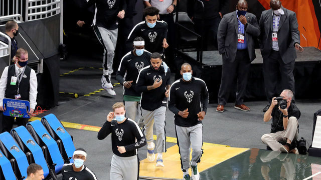 ORLANDO, FL - JANUARY 11: Masked Milwaukee Bucks players enter the court against the Orlando Magic at Amway Center on January 11, 2021 in Orlando, Florida.