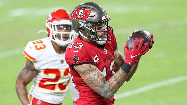 TAMPA, FL - NOVEMBER 29: Mike Evans (13) of the Bucs catches a touchdown pass as Armani Watts (23) of the Chiefs looks on during the regular season game between the Kansas City Chiefs and the Tampa Bay Buccaneers on November 29, 2020 at Raymond James Stadium in Tampa, Florida.