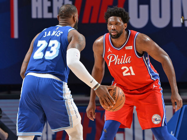 PHILADELPHIA, PA - JANUARY 27: Joel Embiid #21 of the Philadelphia 76ers plays defense against LeBron James #23 of the Los Angeles Lakers on January 27, 2021 at Wells Fargo Center in Philadelphia, Pennsylvania. NOTE TO USER: User expressly acknowledges and agrees that, by downloading and/or using this Photograph, user is consenting to the terms and conditions of the Getty Images License Agreement. Mandatory Copyright Notice: Copyright 2021 NBAE