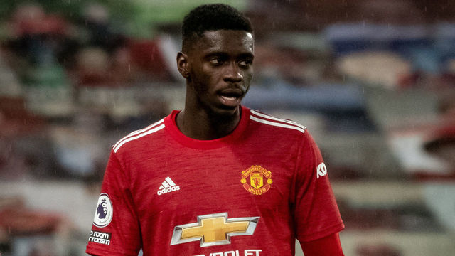 MANCHESTER, ENGLAND - JANUARY 27: Axel Tuanzebe of Manchester United looks on during the Premier League match between Manchester United and Sheffield United at Old Trafford on January 27, 2021 in Manchester, United Kingdom. Sporting stadiums around the UK remain under strict restrictions due to the Coronavirus Pandemic as Government social distancing laws prohibit fans inside venues resulting in games being played behind closed doors.