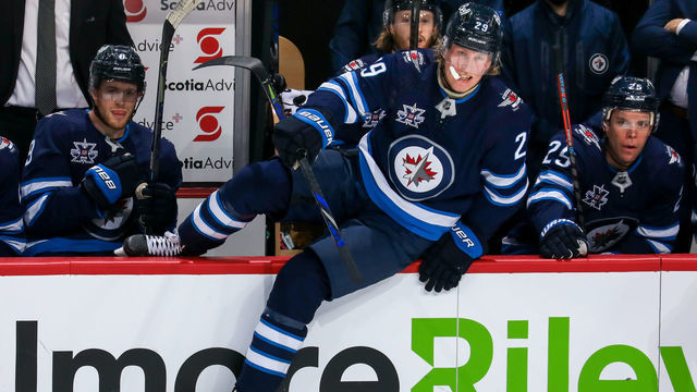 WINNIPEG, MANITOBA - JANUARY 14: Patrik Laine #29 of the Winnipeg Jets changes on the fly during third period action against the Calgary Flames at Bell MTS Place on January 14, 2021 in Winnipeg, Manitoba.