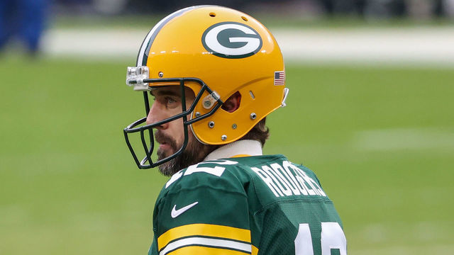 GREEN BAY, WISCONSIN - JANUARY 24: Aaron Rodgers #12 of the Green Bay Packers warms up before the NFC Championship game against the Tampa Bay Buccaneers at Lambeau Field on January 24, 2021 in Green Bay, Wisconsin.