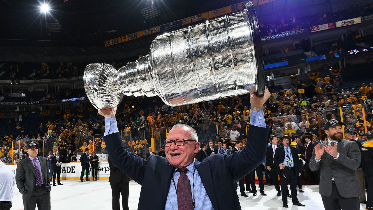 NASHVILLE, TN - JUNE 11: General Manager Jim Rutherford of the Pittsburgh Penguins lifts the Stanley Cup after Game Six of the 2017 NHL Stanley Cup Final at the Bridgestone Arena on June 11, 2017 in Nashville, Tennessee. The Penguins defeated the Predators 2-0. The Pittsburgh Penguins win the Stanley Cup Final series against the Nashville Predators 4-2.