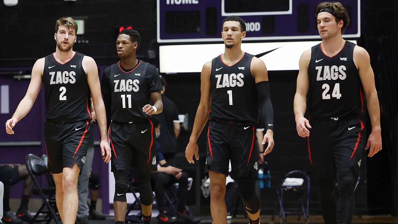PORTLAND, OREGON - JANUARY 09: Anton Watson #22, Drew Timme #2, Joel Ayayi #11, Jalen Suggs #1, Corey Kispert #24 of the Gonzaga Bulldogs walk back to the court after a timeout during the first half against the Portland Pilots at Chiles Center on January 09, 2021 in Portland, Oregon.