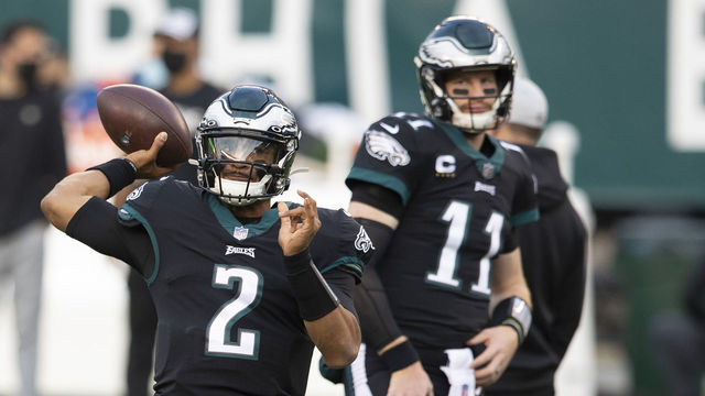 PHILADELPHIA, PA - DECEMBER 13: Jalen Hurts #2 of the Philadelphia Eagles warms up as Carson Wentz #11 looks on prior to the game against the New Orleans Saints at Lincoln Financial Field on December 13, 2020 in Philadelphia, Pennsylvania.