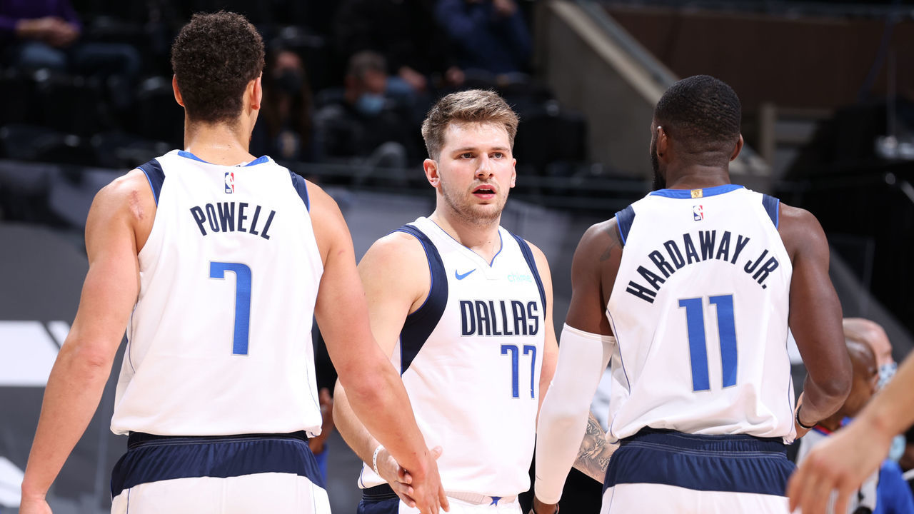 SALT LAKE CITY, UT - JANUARY 29: Luka Doncic #77 of the Dallas Mavericks high fives his teammates during the game against the Utah Jazz on January 29, 2021 at vivint.SmartHome Arena in Salt Lake City, Utah. Mandatory Copyright Notice: Copyright 2021 NBAE