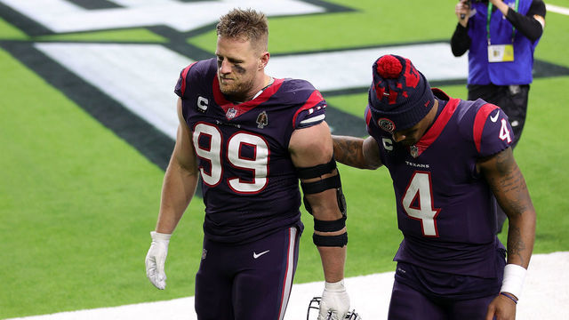 HOUSTON, TEXAS - JANUARY 03: J.J. Watt #99 of the Houston Texans walks off the field with Deshaun Watson #4 at NRG Stadium on January 03, 2021 in Houston, Texas.