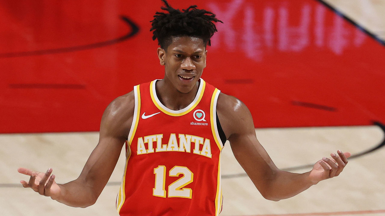PORTLAND, OREGON - JANUARY 16: De'Andre Hunter #12 of the Atlanta Hawks reacts in the first quarter against the Portland Trail Blazers at Moda Center on January 16, 2021 in Portland, Oregon.