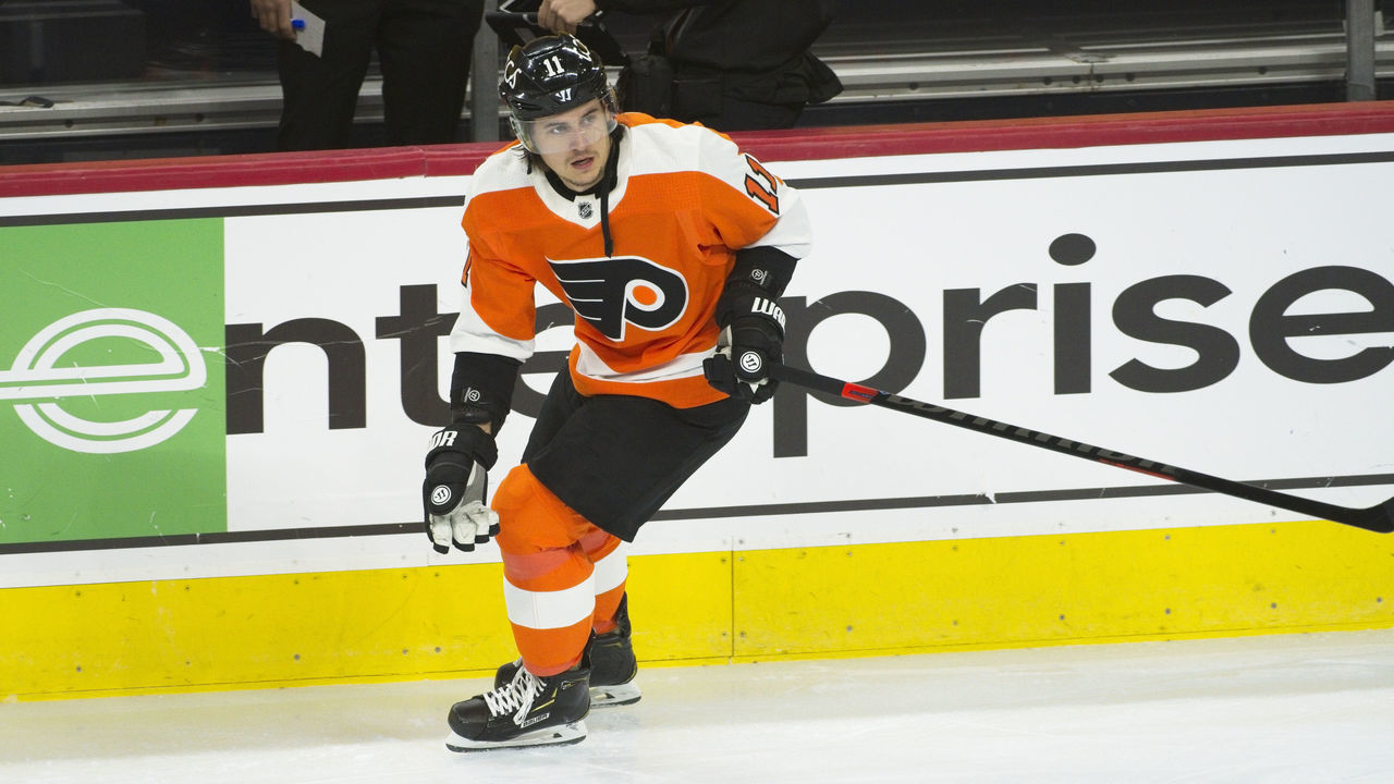 PHILADELPHIA, PA - JANUARY 18: Philadelphia Flyers Right Wing Travis Konecny (11) passes the puck during the game between the Buffalo Sabres and the Philadelphia Flyers on January 18, 2021 at Wells Fargo Center in Philadelphia, PA. (