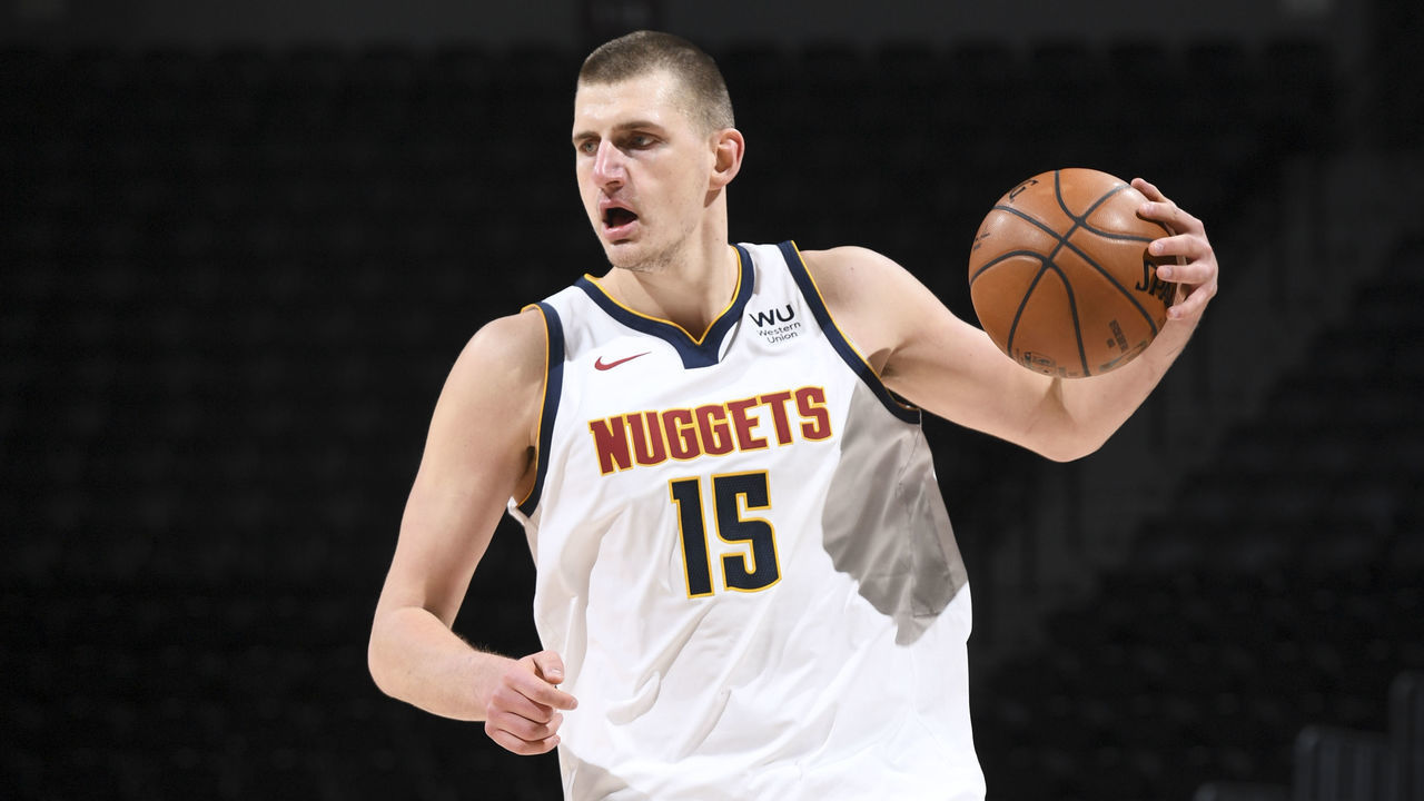 DENVER, CO - JANUARY 31: Nikola Jokic #15 of the Denver Nuggets handles the ball during the game against the Utah Jazz on January 31, 2021 at the Ball Arena in Denver, Colorado. NOTE TO USER: User expressly acknowledges and agrees that, by downloading and/or using this Photograph, user is consenting to the terms and conditions of the Getty Images License Agreement. Mandatory Copyright Notice: Copyright 2021 NBAE