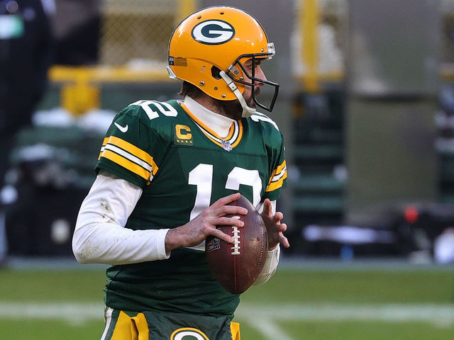 GREEN BAY, WISCONSIN - JANUARY 24: Aaron Rodgers #12 of the Green Bay Packers looks to pass during the NFC Championship game against the Tampa Bay Buccaneers at Lambeau Field on January 24, 2021 in Green Bay, Wisconsin. The Buccaneers defeated the Packers 31-26.