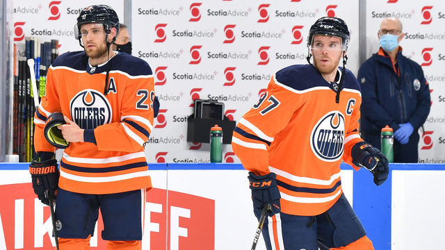 EDMONTON, AB - JANUARY 31: Connor McDavid #97, Leon Draisaitl #29 and Darnell Nurse #25 of the Edmonton Oilers warms up prior to the game against the Ottawa Senators on January 31, 2021 at Rogers Place in Edmonton, Alberta, Canada.