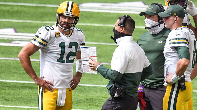 MINNEAPOLIS, MN - SEPTEMBER 13: Green Bay Packers Quarterback Aaron Rodgers (12) talks with Green Bay Packers Head Coach Matt LaFleur as Green Bay Packers Quarterback Tim Boyle (8) looks on during a time out of a National Football League game between the Minnesota Vikings and Green Bay Packers on September 13, 2020, at US Bank Stadium, Minneapolis, MN.