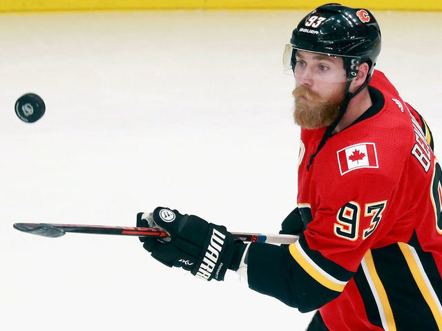 EDMONTON, ALBERTA - AUGUST 20: Sam Bennett #93 of the Calgary Flames juggles the puck during warm-ups prior to the game against the Dallas Stars in Game Six of the Western Conference First Round during the 2020 NHL Stanley Cup Playoffs at Rogers Place on August 20, 2020 in Edmonton, Alberta, Canada.