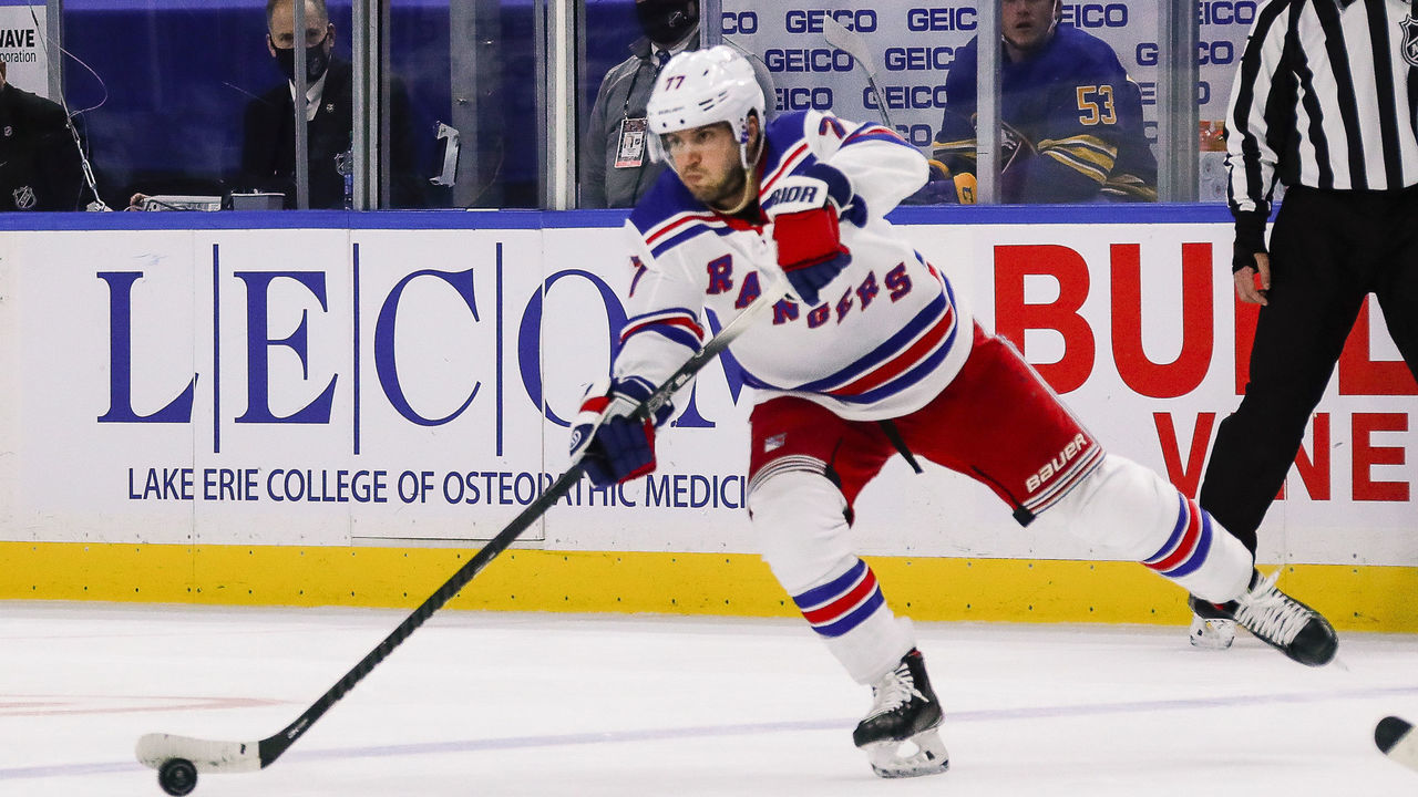 BUFFALO, NY - JANUARY 28: New York Rangers defenseman Tony DeAngelo (77) passes the puck during the New York Rangers and Buffalo Sabres NHL game on January 28, 2021, at KeyBank Center in Buffalo, NY.