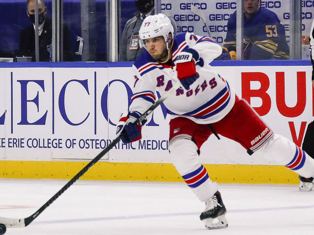 BUFFALO, NY - JANUARY 28: New York Rangers defenseman Tony DeAngelo (77) passes the puck during the New York Rangers and Buffalo Sabres NHL game on January 28, 2021, at KeyBank Center in Buffalo, NY.