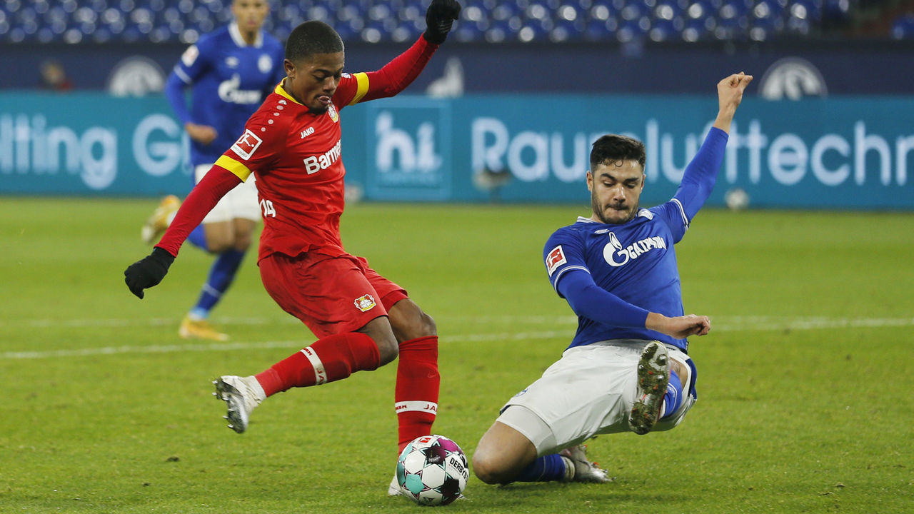 Leverkusen's Jamaican midfielder Leon Bailey (L) and Schalke's Turkish defender Ozan Kabak vie for the ball during the German first division Bundesliga football match FC Schalke 04 v Bayer Leverkusen in Gelsenkirchen, western Germany on December 6, 2020.