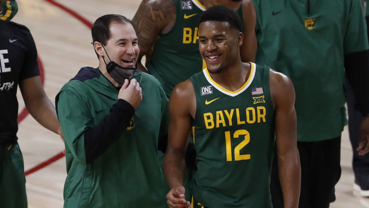 AMES, IA - JANUARY 02: Head coach Scott Drew of the Baylor Bears walks off the court with Jared Butler #12 of the Baylor Bears after winning 76-65 over the Iowa State Cyclones at Hilton Coliseum on January 02, 2021 in Ames, Iowa. The Baylor Bears won 76-65 over the Iowa State Cyclones.