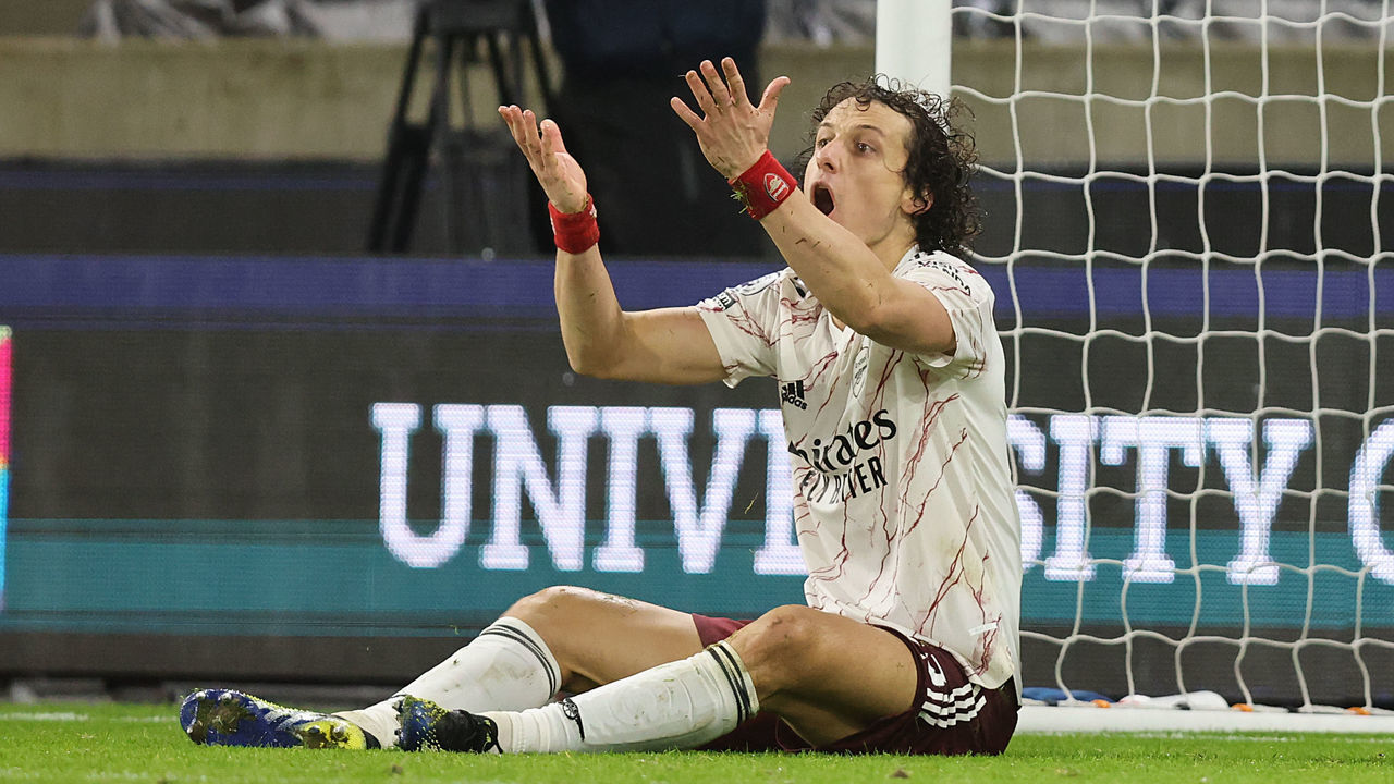 WOLVERHAMPTON, ENGLAND - FEBRUARY 02: David Luiz of Arsenal reacts after a tackle which results in a red card and a penalty during the Premier League match between Wolverhampton Wanderers and Arsenal at Molineux on February 2, 2021 in Wolverhampton, United Kingdom. Sporting stadiums around the UK remain under strict restrictions due to the Coronavirus Pandemic as Government social distancing laws prohibit fans inside venues resulting in games being played behind closed doors.