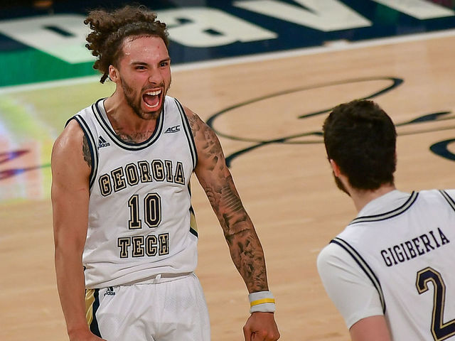 ATLANTA, GA JANUARY 20: Georgia Tech guard Jose Alvarado (10) reacts after teammate Saba Gigiberia (2) hit a three point shot late in the game during the NCAA basketball game between the Clemson Tigers and the Georgia Tech Yellow Jackets on January 20th, 2021 at Hank McCamish Pavilion in Atlanta, GA.