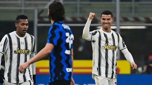 Juventus' Portuguese forward Cristiano Ronaldo (R) celebrates after scoring his second goal during the Italian Cup quarter final first leg football match beetween Inter Milan and Juventus Turin on February 2, 2021 at the San Siro stadium in Milan.