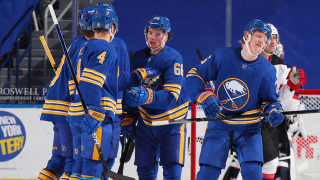 BUFFALO, NY - JANUARY 31: Rasmus Dahlin #26 celebrates his goal with Victor Olofsson #68 and Taylor Hall #4 of the Buffalo Sabres during an NHL game against the New Jersey Devils on January 31, 2021 at KeyBank Center in Buffalo, New York.