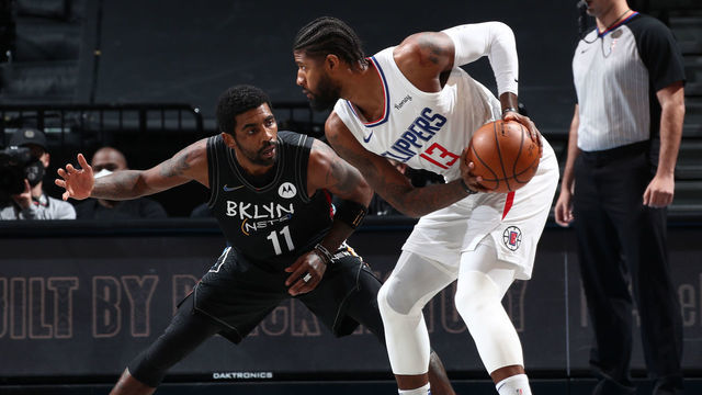 BROOKLYN, NY - FEBRUARY 2: Kyrie Irving #11 of the Brooklyn Nets plays defense during the game against Paul George #13 of the LA Clippers on February 2, 2021 at Barclays Center in Brooklyn, New York. Mandatory Copyright Notice: Copyright 2021 NBAE