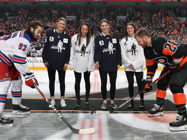 PHILADELPHIA, PA - FEBRUARY 28: Claude Giroux #28 of the Philadelphia Flyers and Mika Zibanejad #93 of the New York Rangers pose for a ceremonial puck drop photo with PWHPA members Megan Keller, Sarah Nurse, Hilary Knight, and Blayre Turnbull on February 28, 2020 at the Wells Fargo Center in Philadelphia, Pennsylvania.