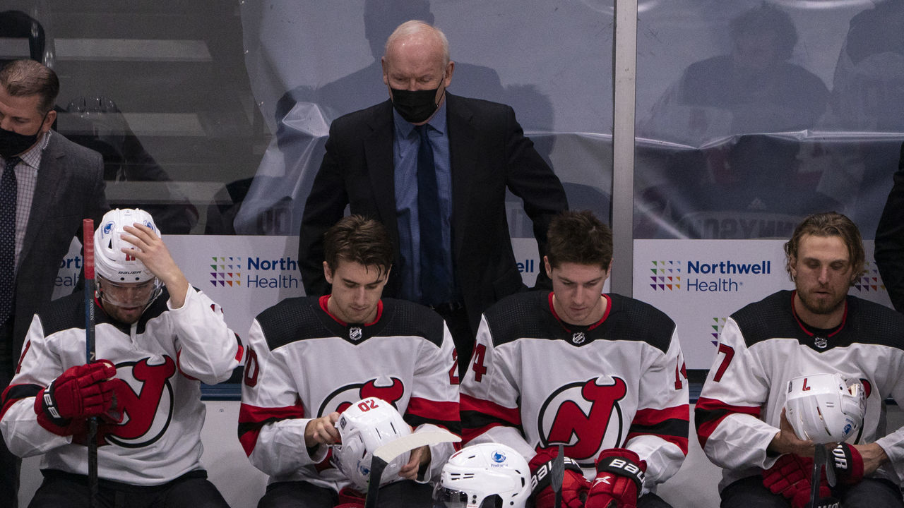 UNIONDALE, NY - JANUARY 21: New Jersey Devils Head Coach Lindy Ruff looks on from the bench during the first period of the National Hockey League game between the New Jersey Devils and the New York Islanders on January 21, 2021, at the Nassau Veterans Memorial Coliseum in Uniondale, NY.