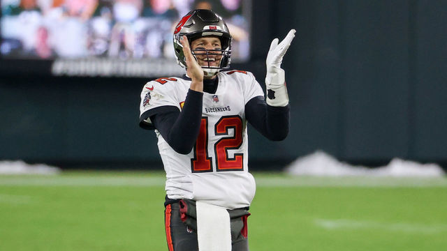 GREEN BAY, WISCONSIN - JANUARY 24: Tom Brady #12 of the Tampa Bay Buccaneers celebrates in the fourth quarter against the Green Bay Packers during the NFC Championship game at Lambeau Field on January 24, 2021 in Green Bay, Wisconsin.