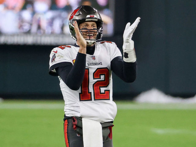 GREEN BAY, WISCONSIN - JANUARY 24: Tom Brady #12 of the Tampa Bay Buccaneers celebrates in the fourth quarter against the Green Bay Packers during the NFC Championship game at Lambeau Field on January 24, 2021 in Green Bay, Wisconsin.