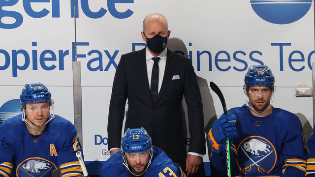 BUFFALO, NY - JANUARY 14: Head coach Ralph Krueger of the Buffalo Sabres watches from the bench during an NHL game against the Washington Capitals on January 14, 2021 at KeyBank Center in Buffalo, New York.