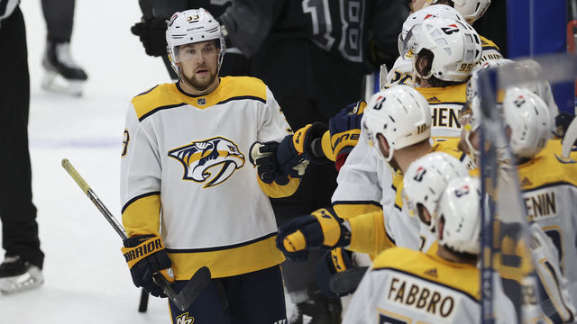 TAMPA, FL - JANUARY 30: Nashville Predators right wing Viktor Arvidsson (33) is congratulated by teammates after scoring a goal during the NHL game between the Nashville Predators and Tampa Bay Lightning on January 30, 2021 at Amalie Arena in Tampa, FL.