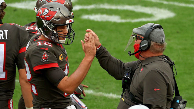 TAMPA, FLORIDA - JANUARY 03: Tom Brady #12 of the Tampa Bay Buccaneers celebrates a touchdown with head coach Bruce Arians of the Tampa Bay Buccaneers during a game against the Atlanta Falcons at Raymond James Stadium on January 03, 2021 in Tampa, Florida.