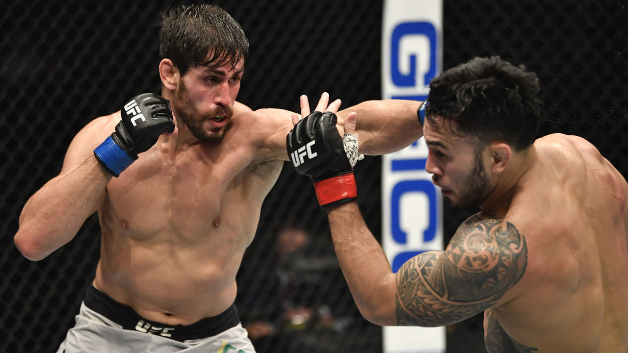 ABU DHABI, UNITED ARAB EMIRATES - JANUARY 23: (L-R) Antonio Carlos Junior of Brazil punches Brad Tavares in a middleweight fight during the UFC 257 event inside Etihad Arena on UFC Fight Island on January 23, 2021 in Abu Dhabi, United Arab Emirates.