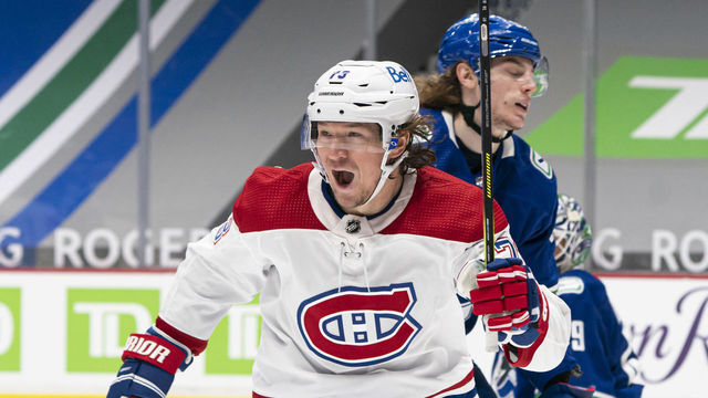 VANCOUVER, BC - JANUARY 20: Tyler Toffoli #73 of the Montreal Canadiens celebrate after scoring a goal while Adam Gaudette #96 of the Vancouver Canucks reacts during NHL hockey action at Rogers Arena on January 20, 2021 in Vancouver, Canada.