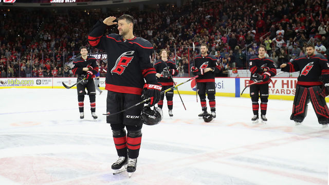 RALEIGH, NC - JANUARY 19: Justin Williams #14 of the Carolina Hurricanes salutes the fans during a Storm Surge on Military Appreciation Night following an NHL game against the New York Islanders on January 19, 2020 at PNC Arena in Raleigh, North Carolina.