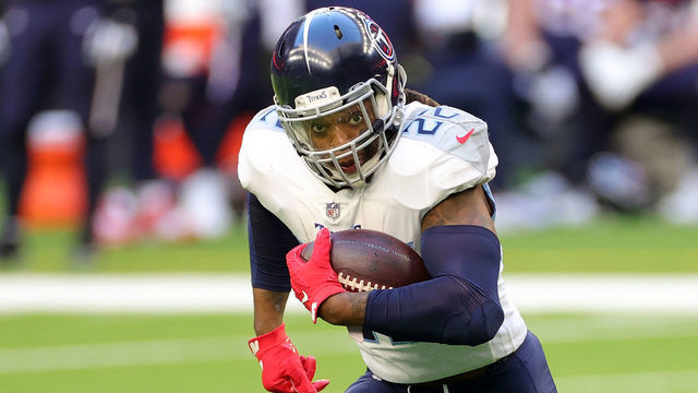 HOUSTON, TEXAS - JANUARY 03: Derrick Henry #22 of the Tennessee Titans runs for yards during the first half against the Houston Texans at NRG Stadium on January 03, 2021 in Houston, Texas.