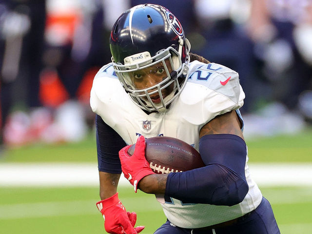 HOUSTON, TEXAS - JANUARY 03: Derrick Henry #22 of the Tennessee Titans runs for yards during the first half against the Houston Texans at NRG Stadium on January 03, 2021 in Houston, Texas.