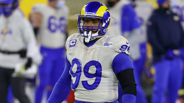 GREEN BAY, WISCONSIN - JANUARY 16: Aaron Donald #99 of the Los Angeles Rams lines up for a play in the fourth quarter against the Green Bay Packers during the NFC Divisional Playoff game at Lambeau Field on January 16, 2021 in Green Bay, Wisconsin.