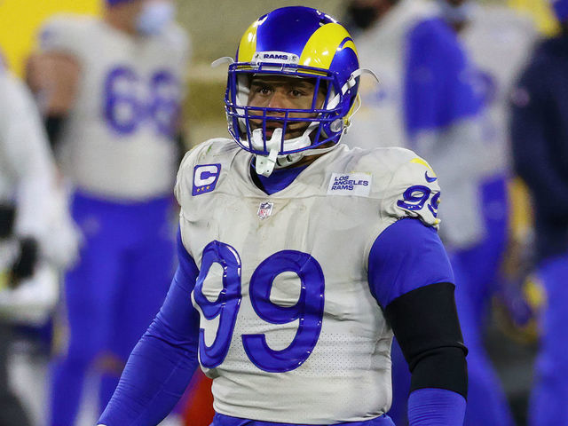 GREEN BAY, WISCONSIN - JANUARY 16: Aaron Donald #99 of the Los Angeles Rams lines up for a play in the fourth quarter against the Green Bay Packers during the NFC Divisional Playoff game at Lambeau Field on January 16, 2021 in Green Bay, Wisconsin.